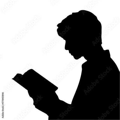 silhouette of a person reading a book