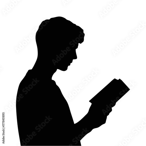 silhouette of a person reading a book