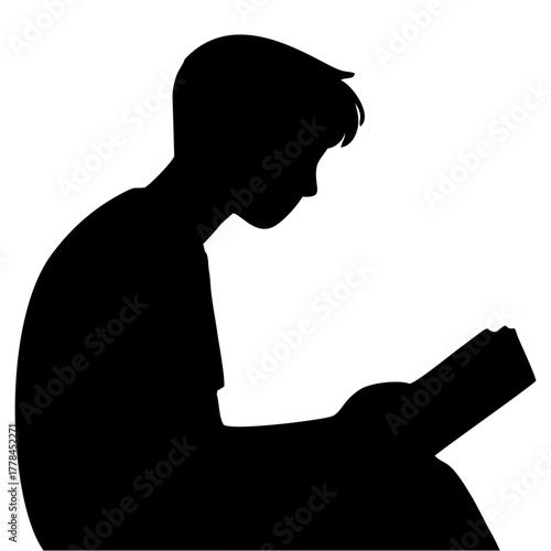 silhouette of a person reading a book