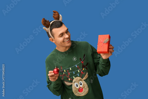 Young man in reindeer horns...