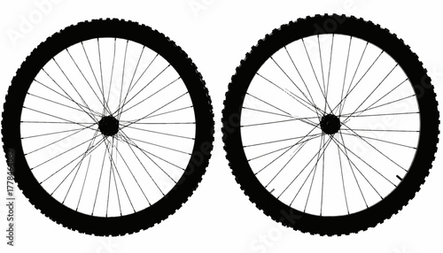 Black silhouettes of two bicycle wheels with tires and spokes, against a white background