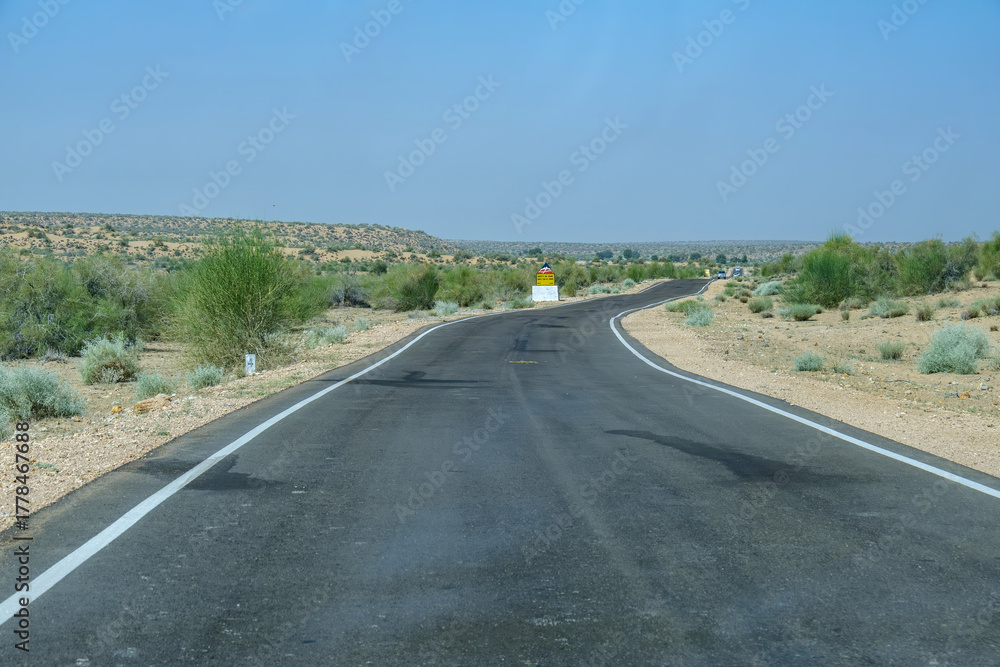 Obraz premium Road through the desert between Jaisalmer and Tanot, near Jaisalmer India.