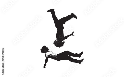 silhouette of a man jumping  and parachute