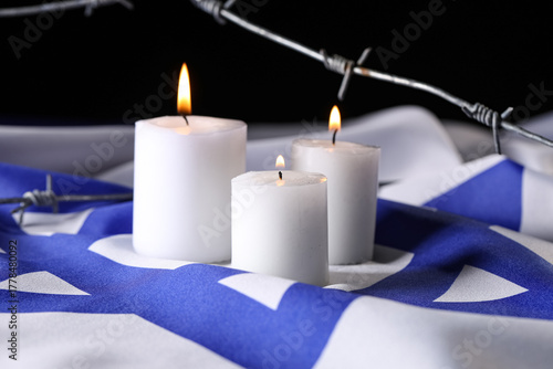 Burning candles and barbed ...