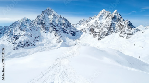 Majestic mountain peaks covered in fresh snow create peaceful winter landscape