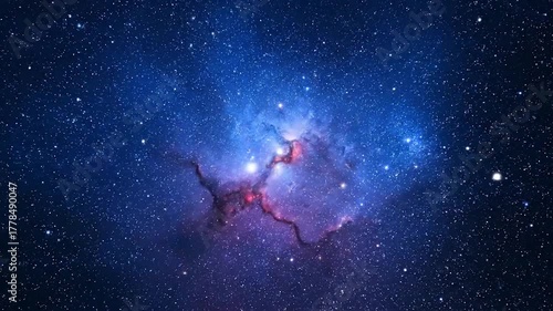 A celestial scene of a vibrant nebula and countless stars in a deep blue and red cosmic vista