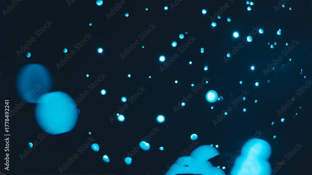 Fototapeta premium Abstract blue bokeh light background with glowing circles and soft focus effect 