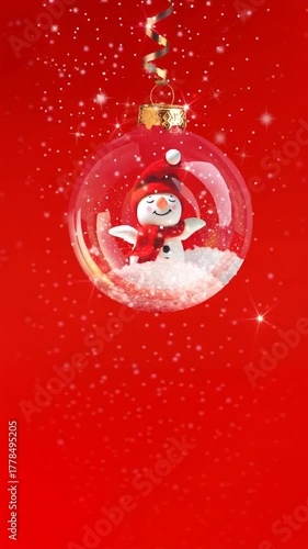 Seamless loop video background with snowman snow and snowfall on red. Inside a transparent Christmas bauble the snowman gently sways and waves while snow falls. Clean minimal scene with copy space.