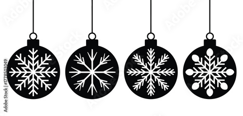 Four black christmas ornaments with snowflake designs hanging