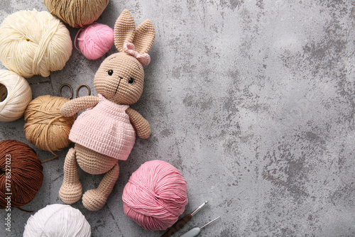 Knitted bunny toy with yarn...