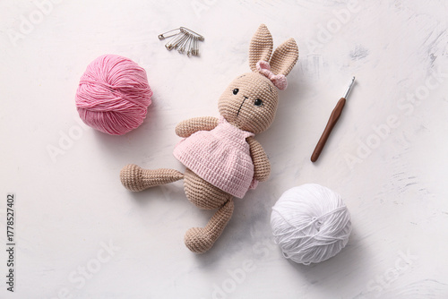 Knitted bunny toy with yarn...