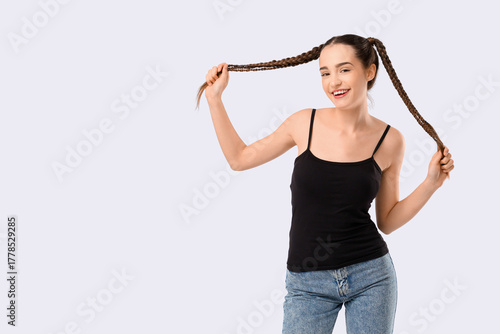 Happy young woman with brai...