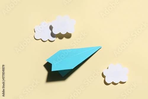 Blue paper plane with cloud...