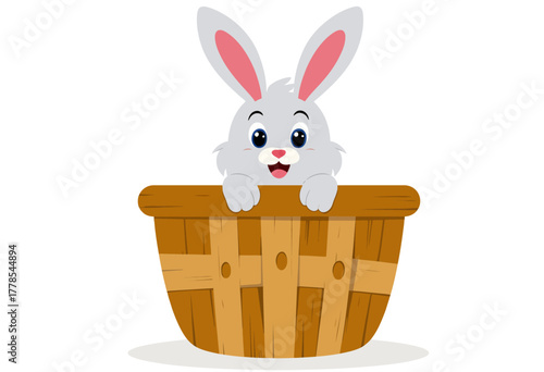 Playful cartoon rabbit peeking happily over the edge of a wooden basket against a simple white background, with big eyes and fluffy ears turned forward