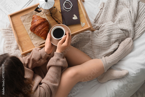 Young woman with cup of esp...