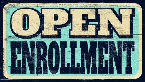 Aged and worn open enrollment sign on wood