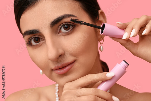 Pretty young woman applying...