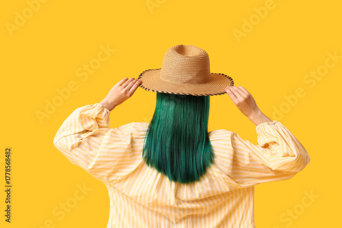 Young woman with green hair...