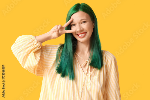 Happy young woman with gree...