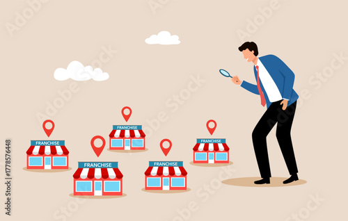 Businessman holding magnifying glass for investment with small business or franchise branch expansion strategy of financial marketing planning.