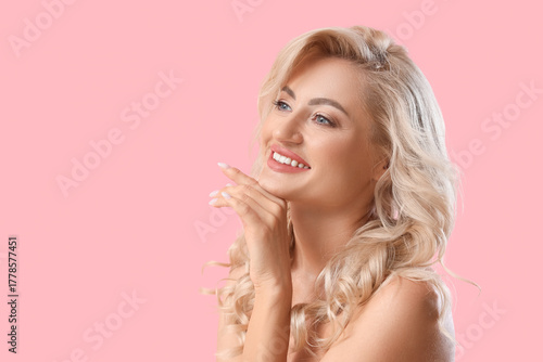 Happy young woman with curl...