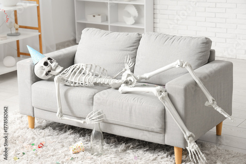 Skeleton wearing a party ha...