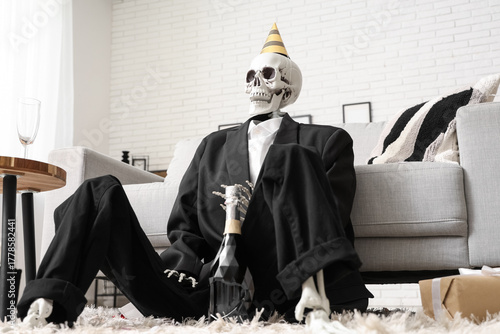Skeleton in party hat and s...