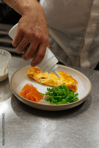 Wallpaper Mural Chef plating omelette with smoked salmon and arugula Torontodigital.ca