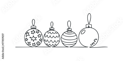 Four decorated Christmas ornaments line up