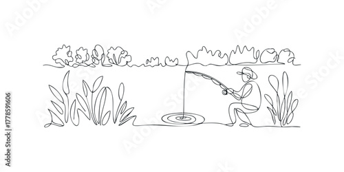 Person fishing at the edge of a lake with reeds
