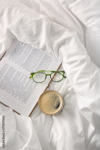 Cup of coffee with book and...