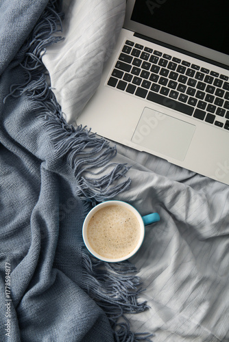 Cup of coffee with laptop a...