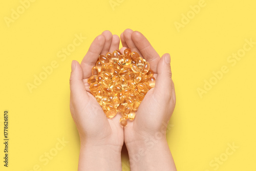 Female hands with vitamin E...