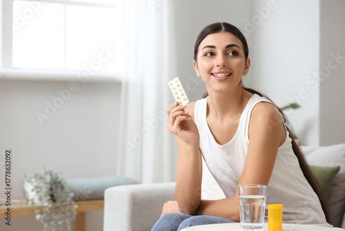 Young woman with vitamin E ...