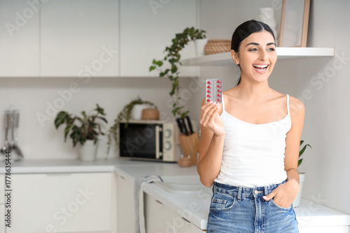 Young woman with vitamin E ...