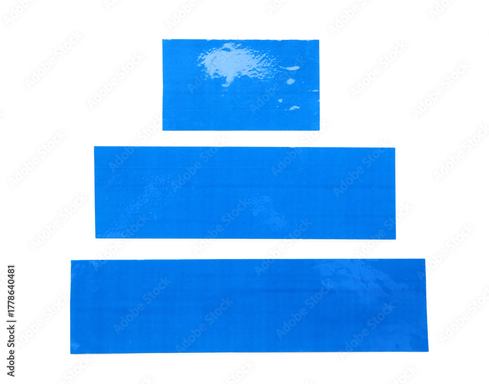 Obraz premium Stripes of blue masking tape isolated on white background, closeup