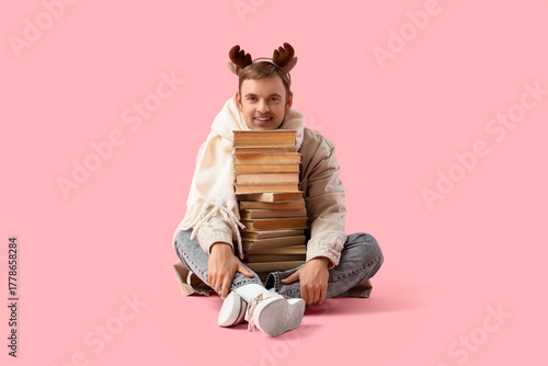 Smiling young man in reinde...