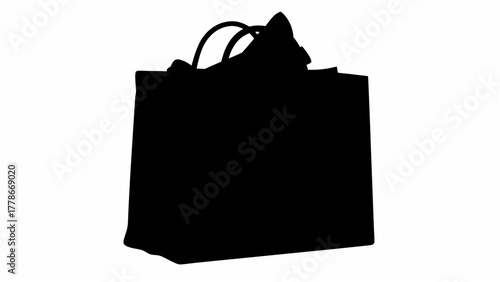 Silhouette of a black shopping bag with handles and crumpled paper sticking out of the top edge view