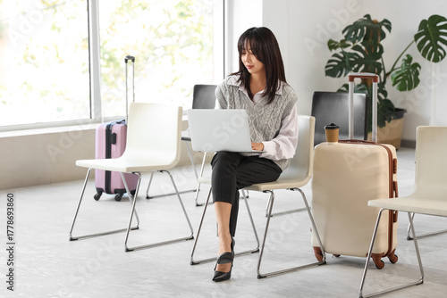 Young asian woman working o...