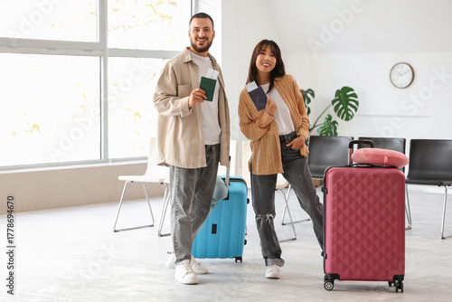 Young couple with passports...