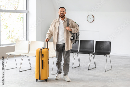 Young man with luggage in a...