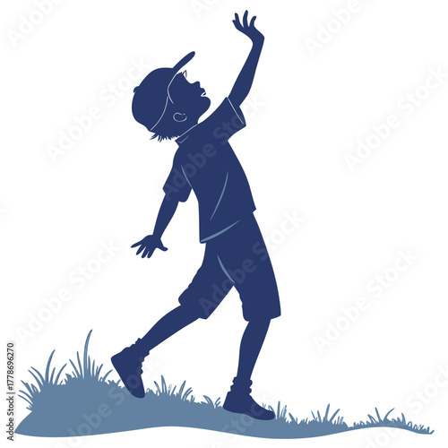 Silhouette of a young boy wearing a baseball cap and shorts reaching upwards with his hand in a playful stance isolated on white background