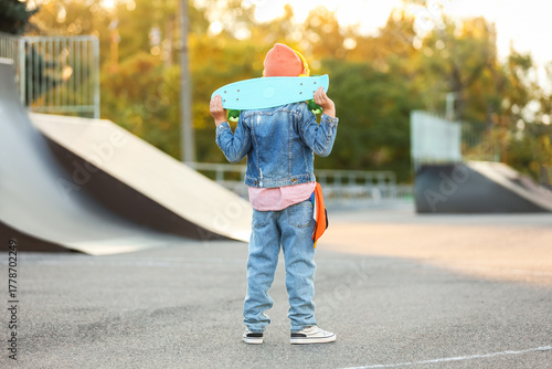 Cool little boy with skateb...