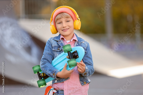 Cool little boy with headph...