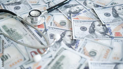 Wallpaper Mural Stethoscope placed on many US dollars indicating high hospital bills, medical insurance cost issues and financial impact of health care decisions. Torontodigital.ca