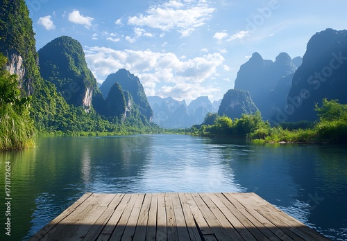 Photo of a peaceful river with green mountains and wooden platform in the foreground