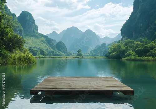 Photo of a peaceful river with green mountains and wooden platform in the foreground