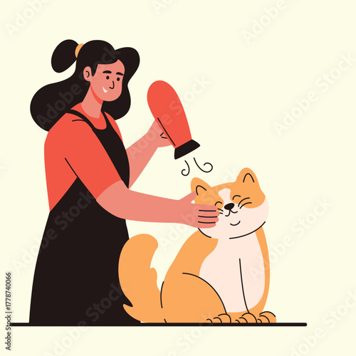 Pet Grooming gently drying the cat’s fur with a warm blower after a nice cleaning session