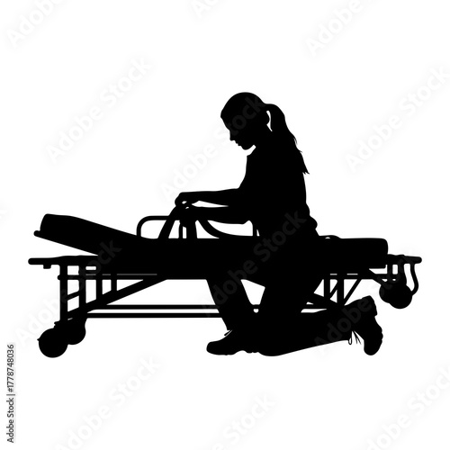 Person tending to medical stretcher silhouette healthcare