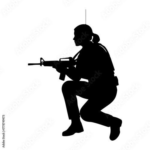 Silhouette of soldier aiming rifle kneeling